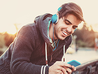 Man listening to enhanced audio on headphones