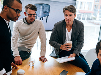 Employees talking into microphone on conference call