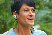 Woman with Earbuds Running